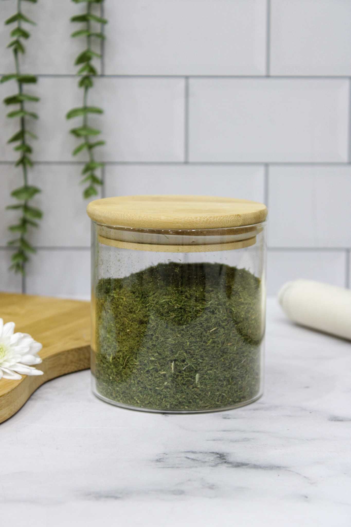 بانکه گرد شیشه‌ای پیرکس مقاوم با درب بامبو واشردار.